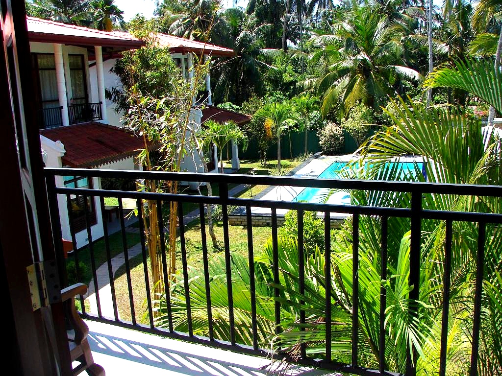 Villa Estuary Deluxe Room — balcony pool view